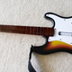 Illustration for article titled Rock Band 2 Wireless Guitar and Drums Hardware Review